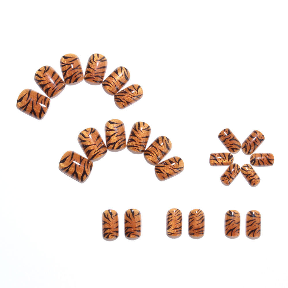 Metallic orange tiger-striped nails