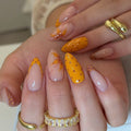Orange polka dot nails