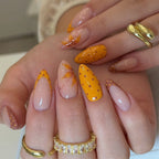 Orange polka dot nails