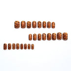 Metallic orange tiger-striped nails