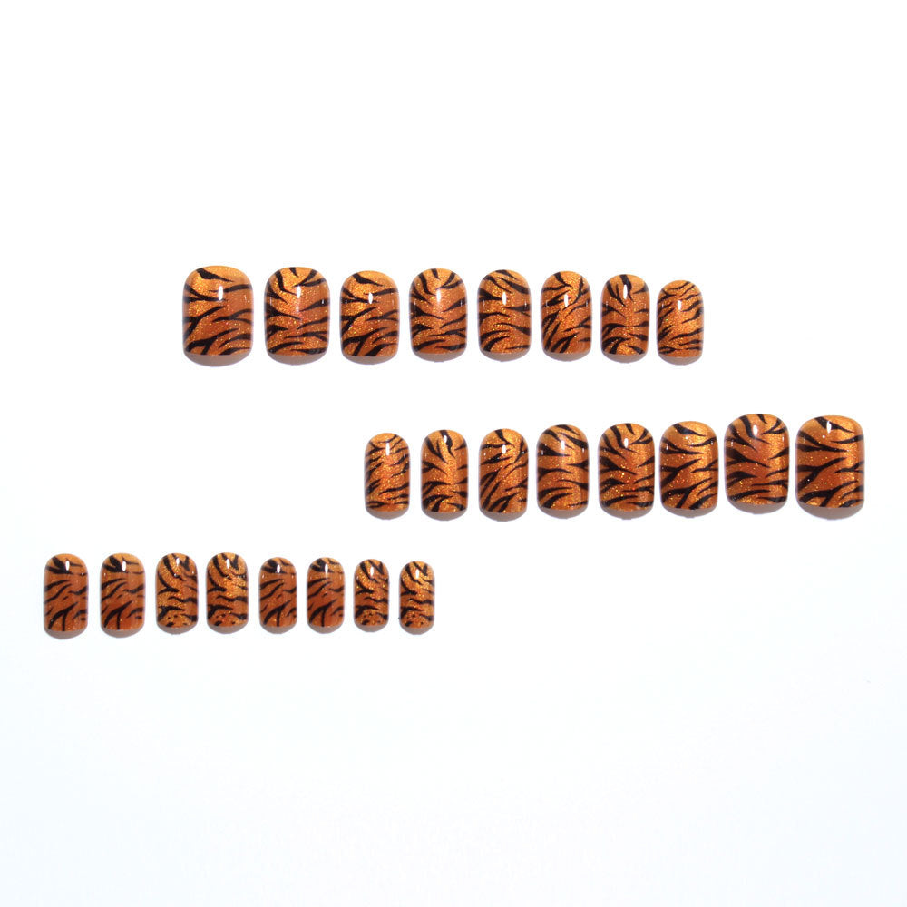 Metallic orange tiger-striped nails