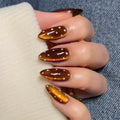 Polka dot cat's eye nails