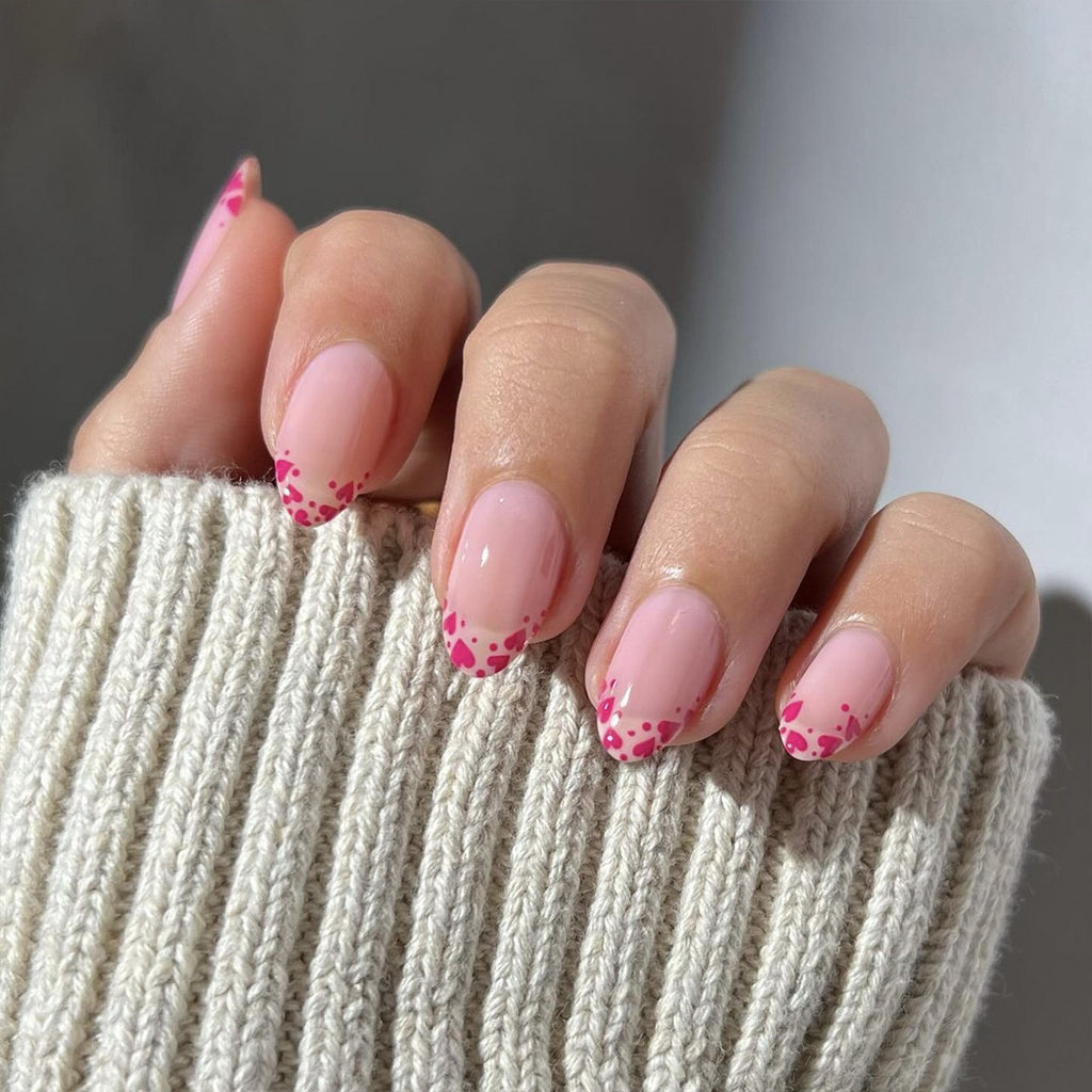 Raspberry heart-shaped nails