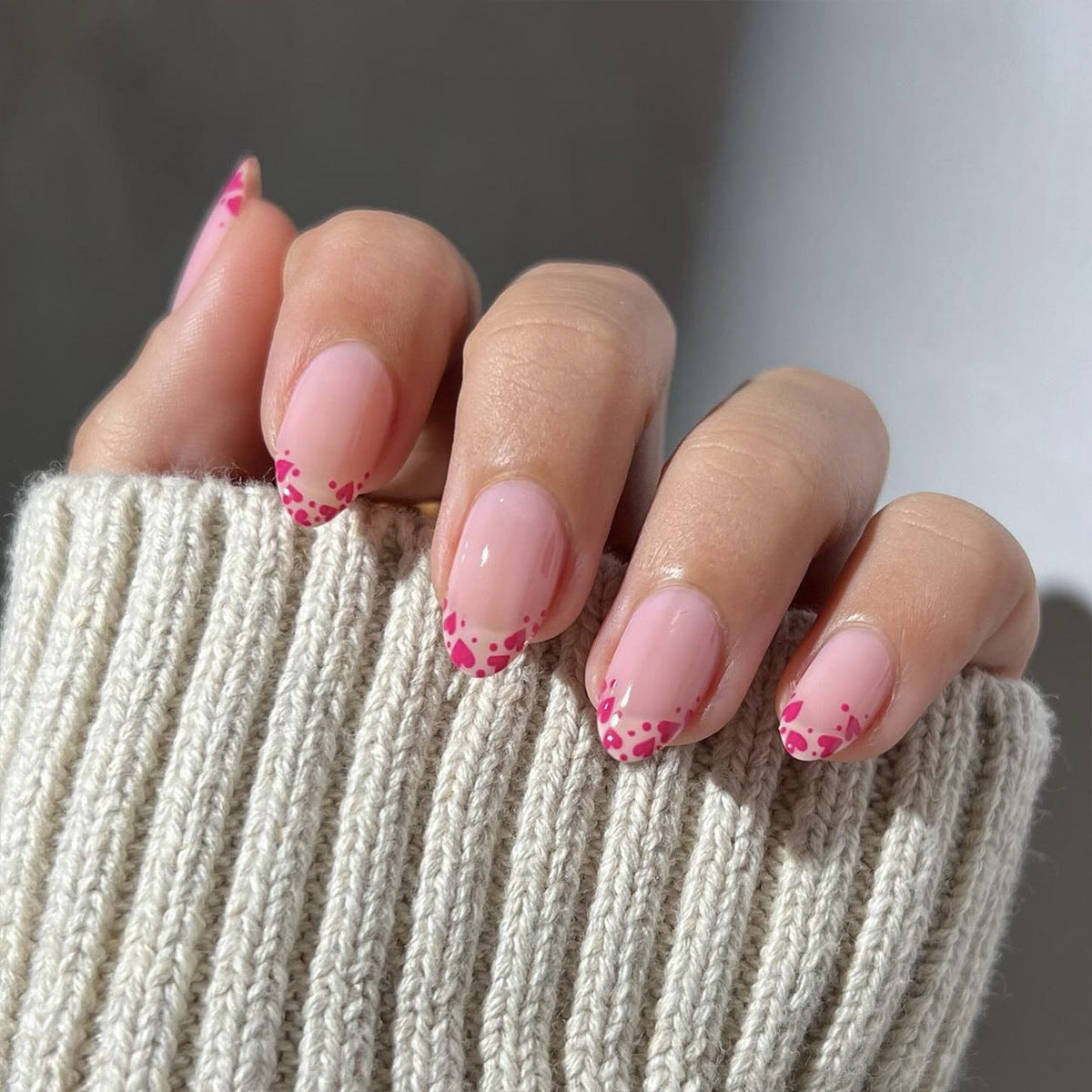Raspberry heart-shaped nails