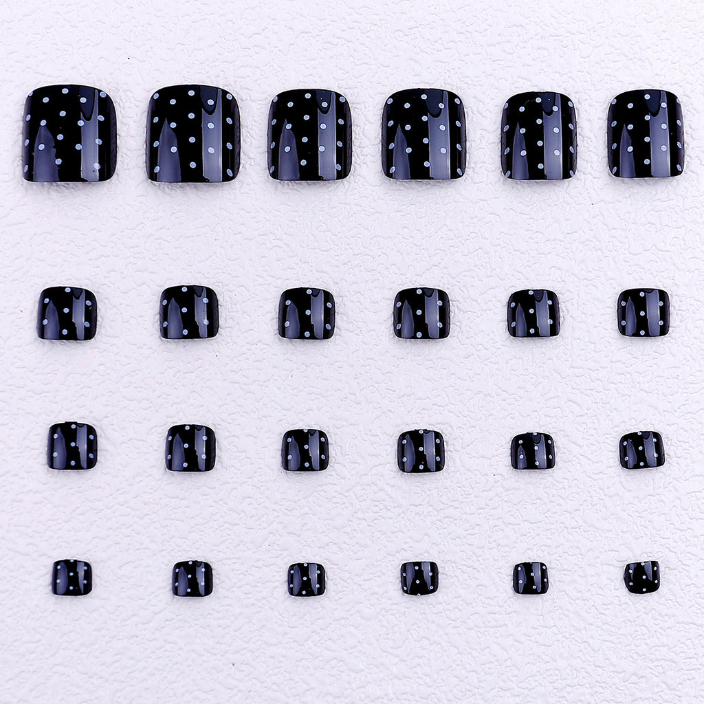 Black and white polka dot toenails