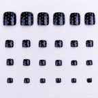 Black and white polka dot toenails
