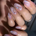Purple butterfly-shaped nails