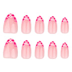 Raspberry heart-shaped nails