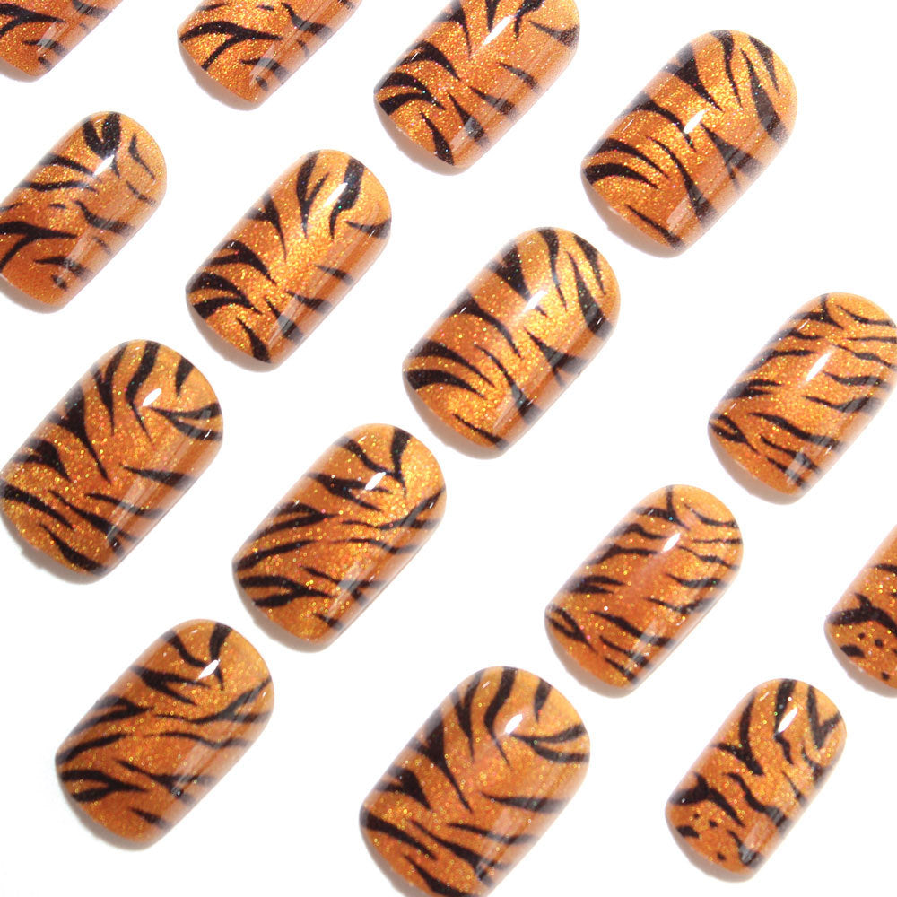 Metallic orange tiger-striped nails