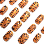 Metallic orange tiger-striped nails