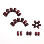 Wine red smudges the nails