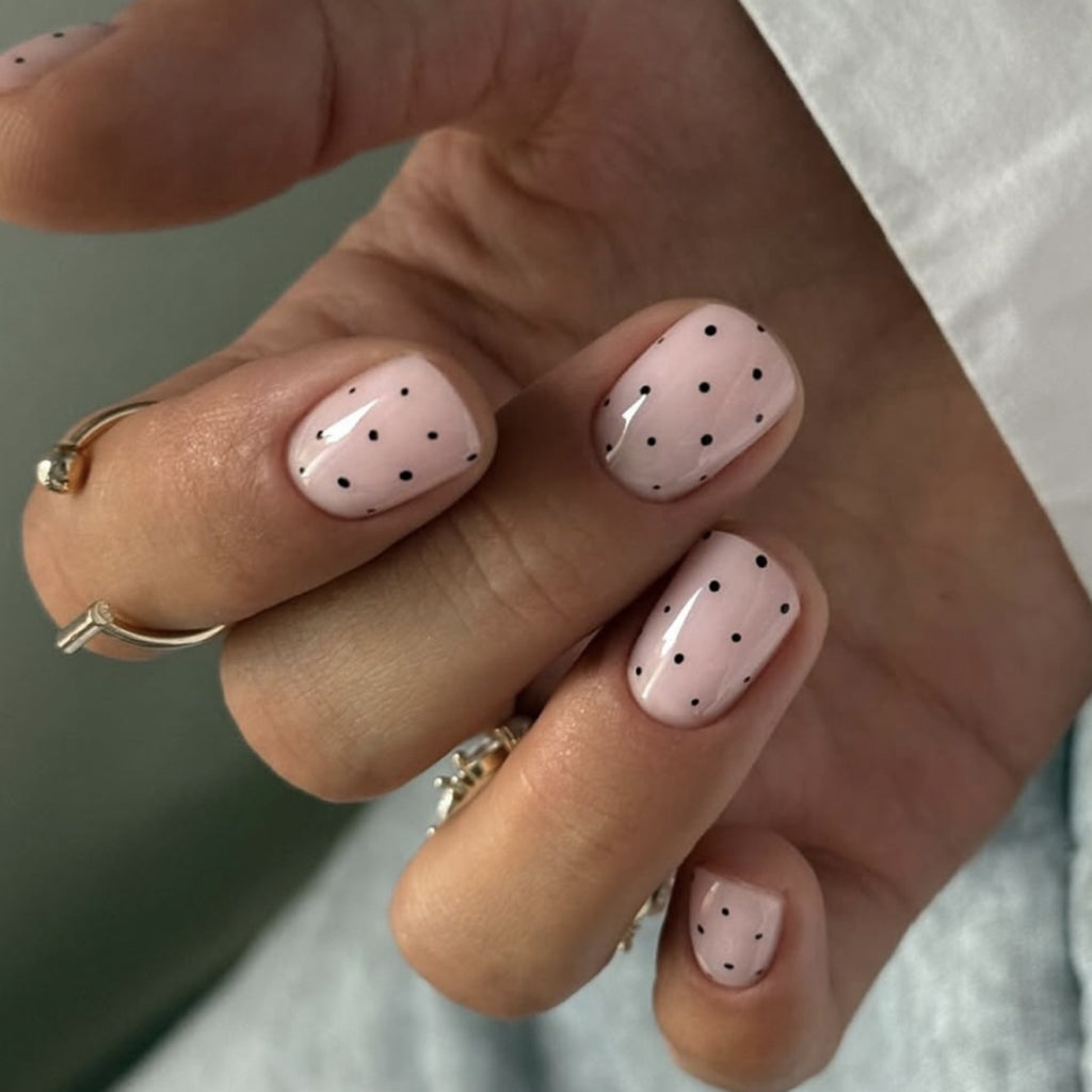 Black polka dot nails