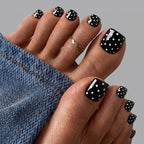 Black and white polka dot toenails
