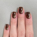 Dark brown cat's eye nails