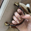 Orange-yellow cat's eye nails