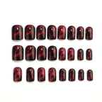 Wine red smudges the nails