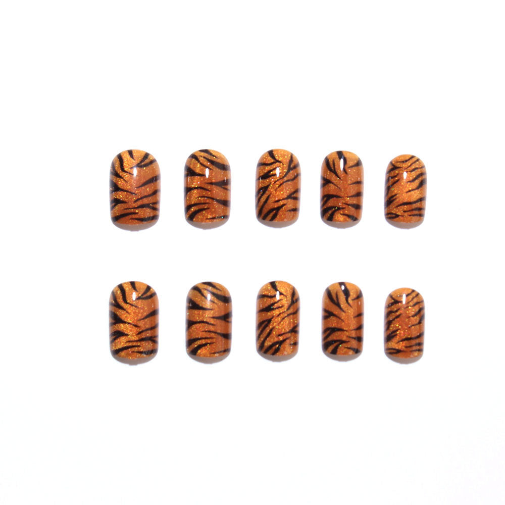 Metallic orange tiger-striped nails