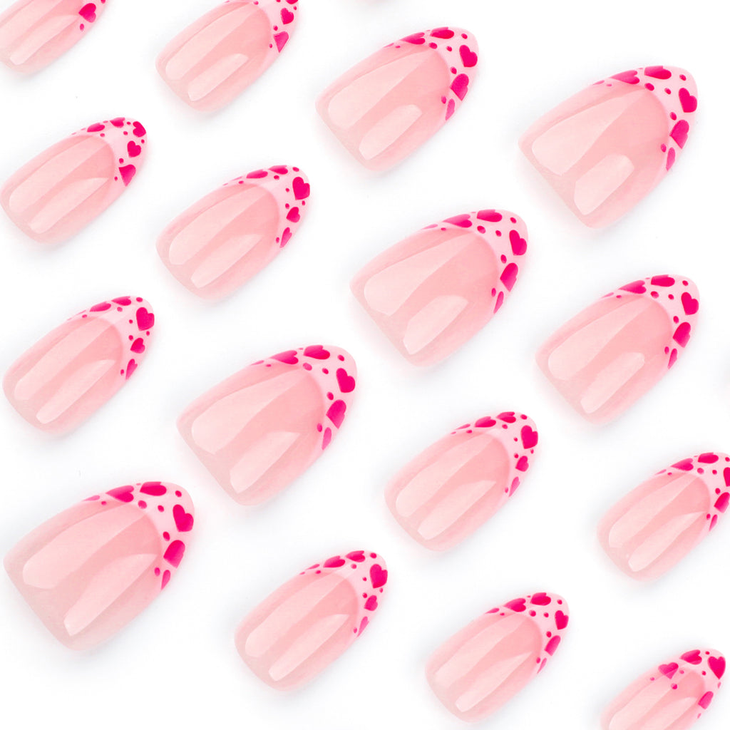 Raspberry heart-shaped nails