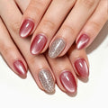 Peach-colored cat's eye nails